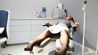 A Steamy Session: Polish Beautician Massages A Client'S Feet At The Gym